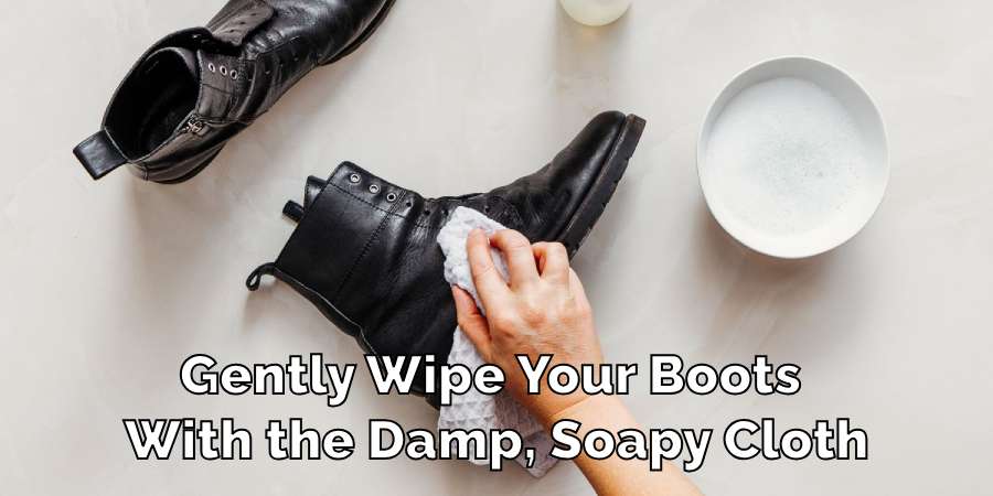 Gently Wipe Your Boots 
With the Damp, Soapy Cloth