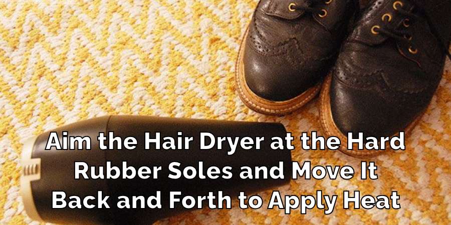 Aim the Hair Dryer at the Hard
Rubber Soles and Move It
Back and Forth to Apply Heat