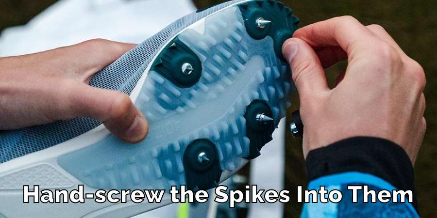 Hand-screw the Spikes Into Them